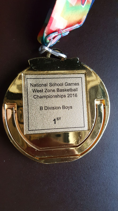 Picture of medal that states 'National School Games West Zone Basketball Championships 2016 B Division Boys 1st